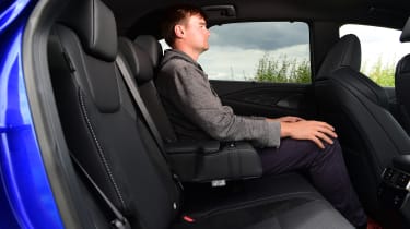 Auto Express staff writer Alastair Crooks sitting in the back seat of the Lexus RX 500h